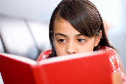 A young reader absorbed in a book